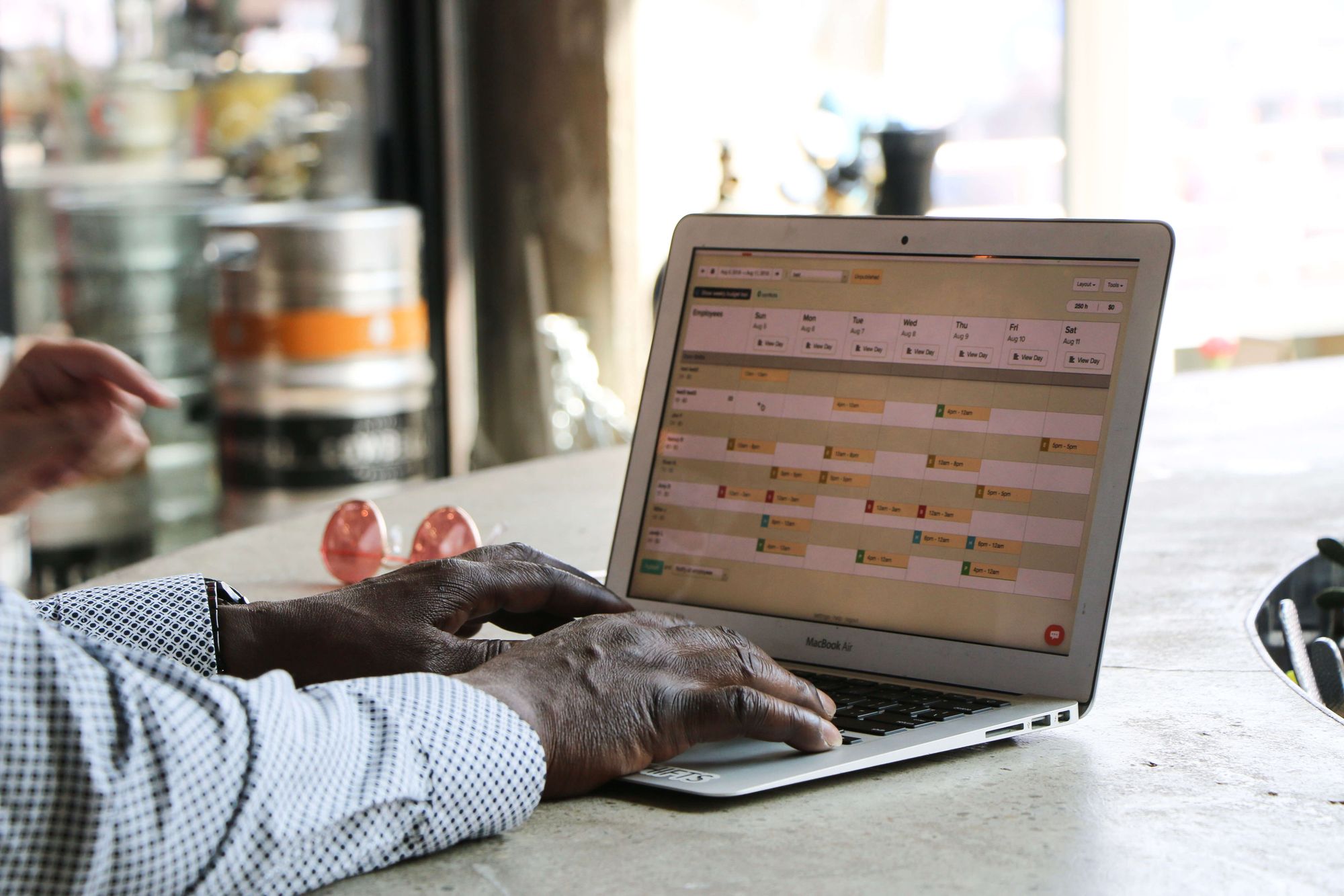 man using computer for restaurant scheduling